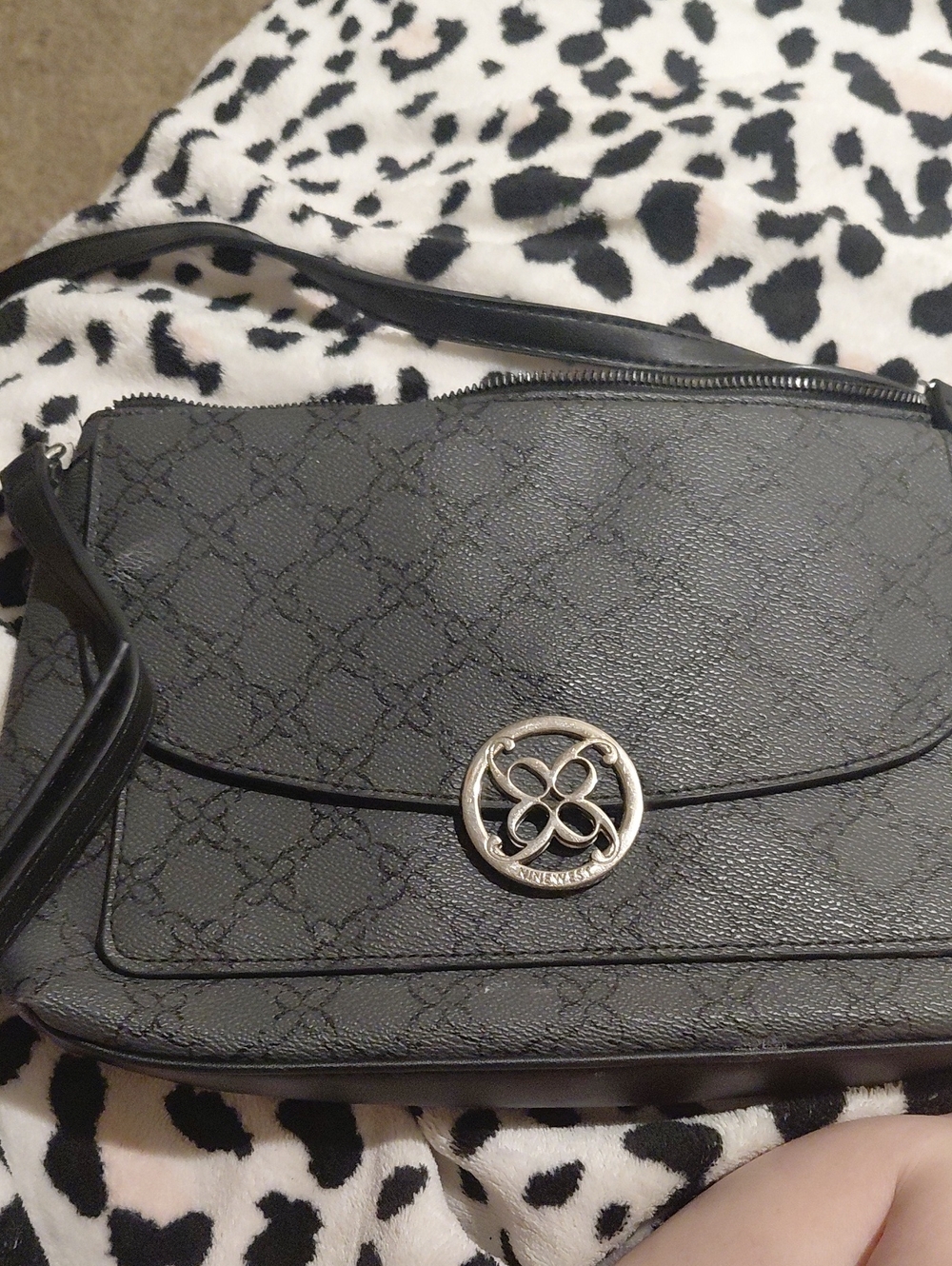Black Crossbody Shoulder Bag with Silver Emblem